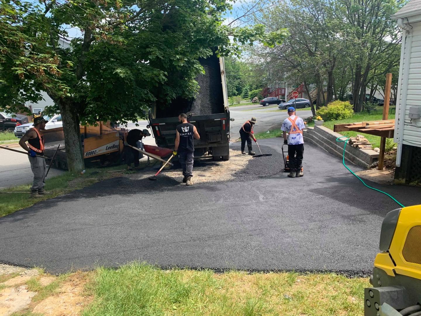 Empire Paving crew working on a residential driveway