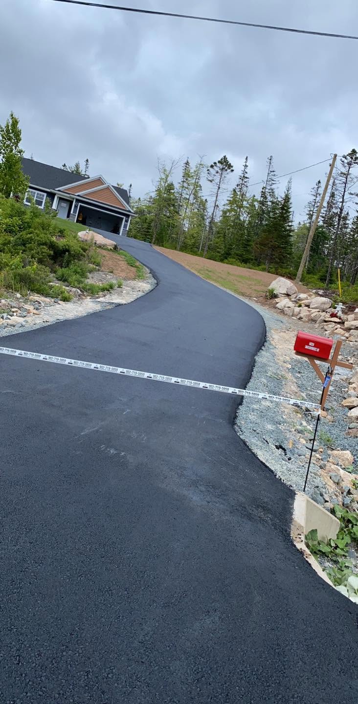 Newly paved long asphalt driveway