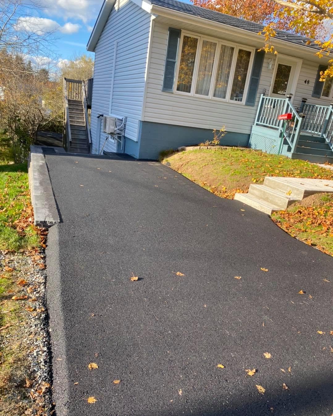 Fresh compact residential asphalt driveway